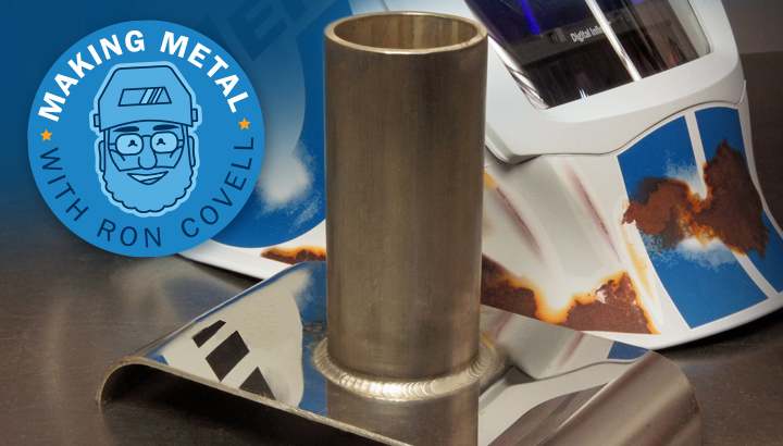Close-up image of TIG weld with Relic helmet in background